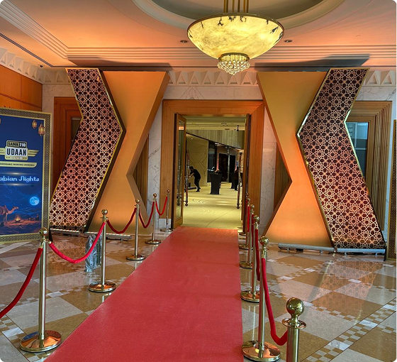 Decorative red-carpeted entrance hallway with ornate pillars