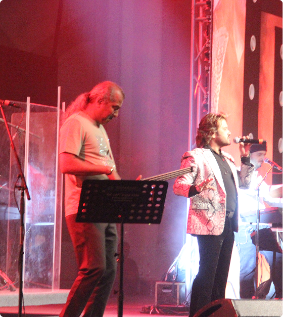 Singer and performer on stage during a live music event