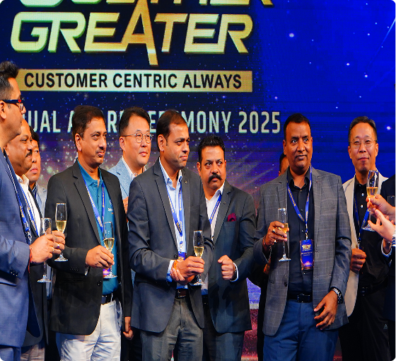 Executives celebrating with champagne at the Greater 2025 award ceremony